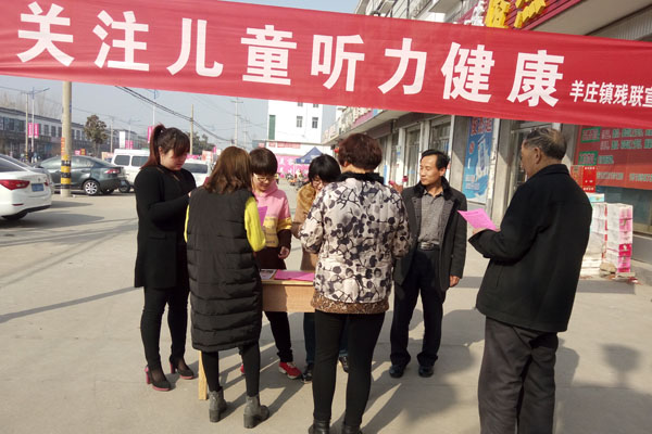 图为着庄镇残联开展活动